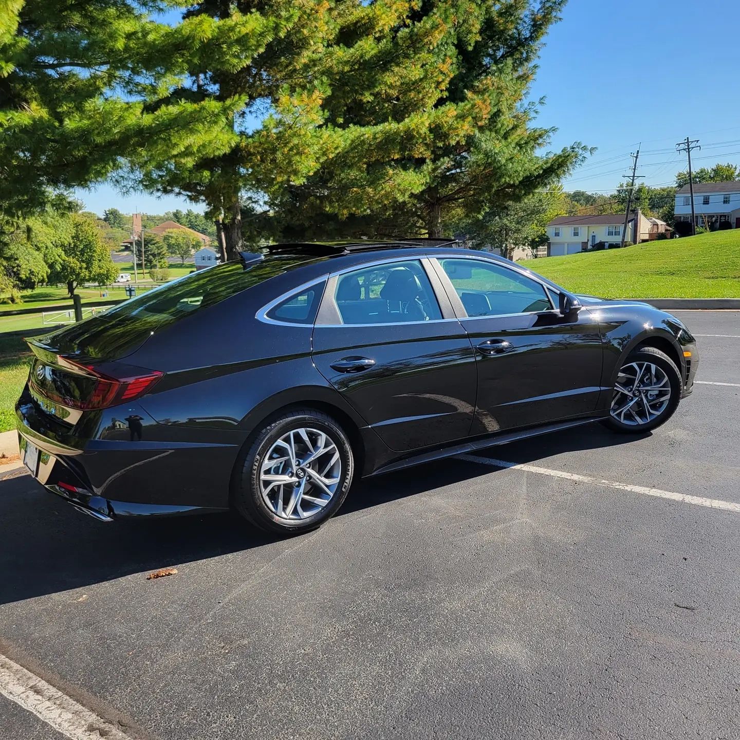 Black sedan driver side